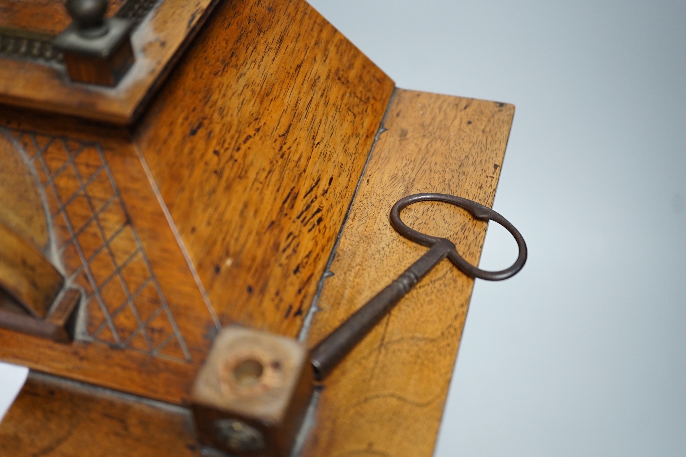 A German oak cased clock, plaque reads ‘Presented to Harry Collins on the occasion of his marriage by the members of Bradford House May 1st 1897’. Height 40cm